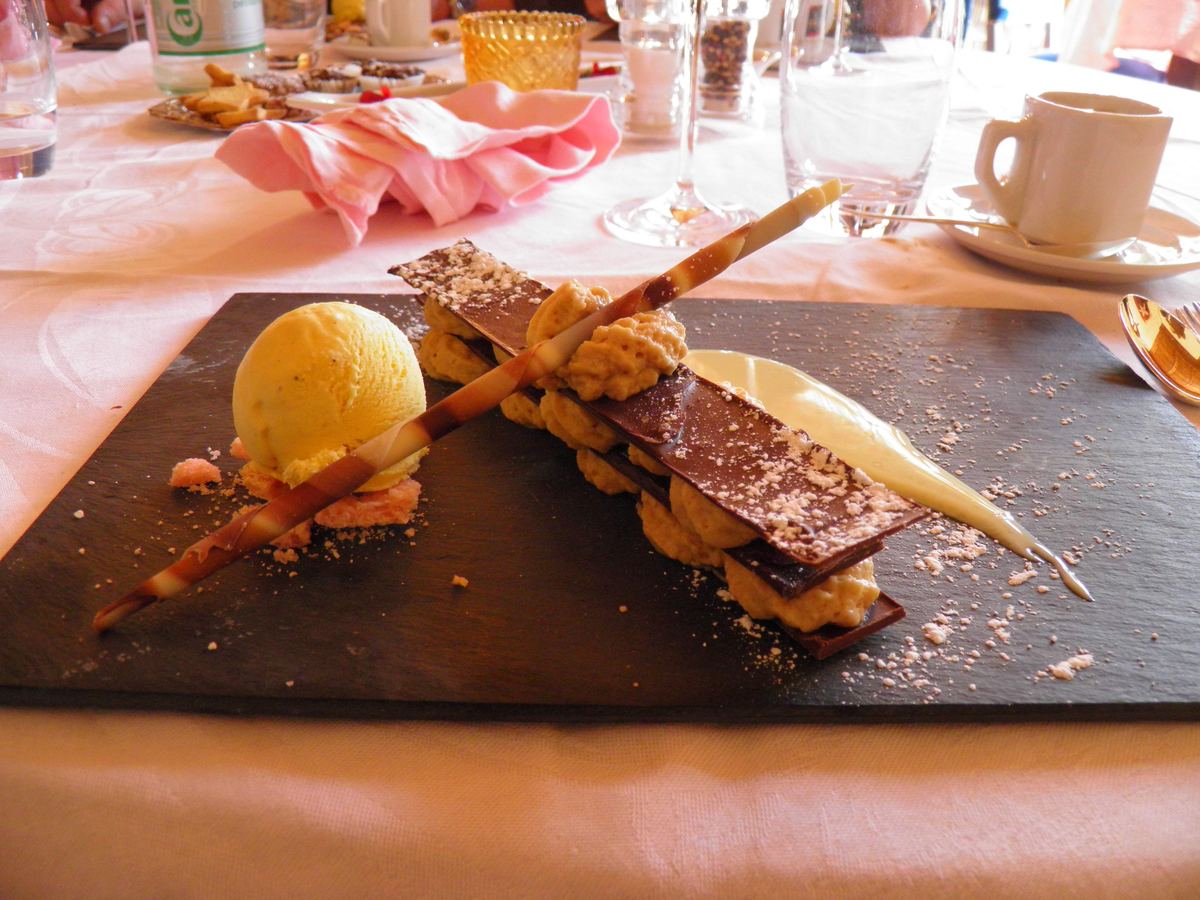A plated millefeuille with a scoop of ice cream